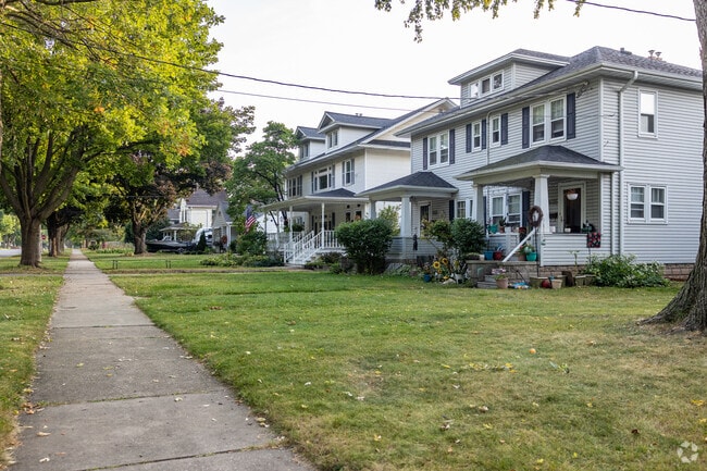 Large older homes sit side by side in the Astor neighborhood.