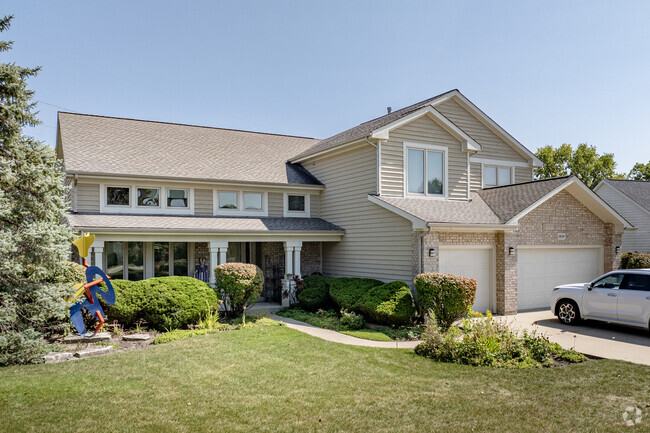 The houses in Rolling Hills are primarily new construction, with manicured front yards.