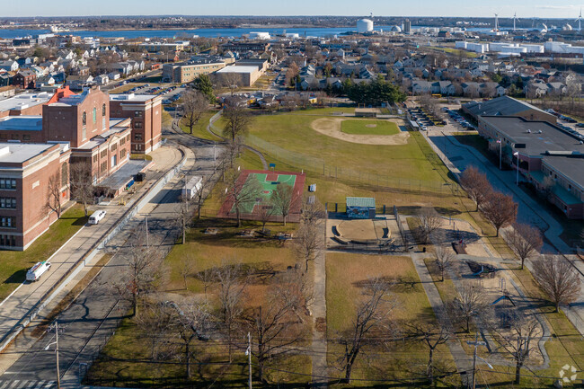 Students play in on the grounds next to the school.
