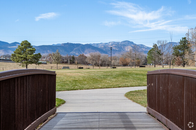 The bridge and mountain views at Leyden Creek Park in Arvada, Colorado