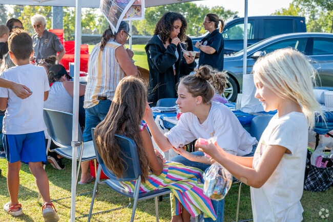 Fountain Valley kids enjoy free face painting at the National Night Out event.