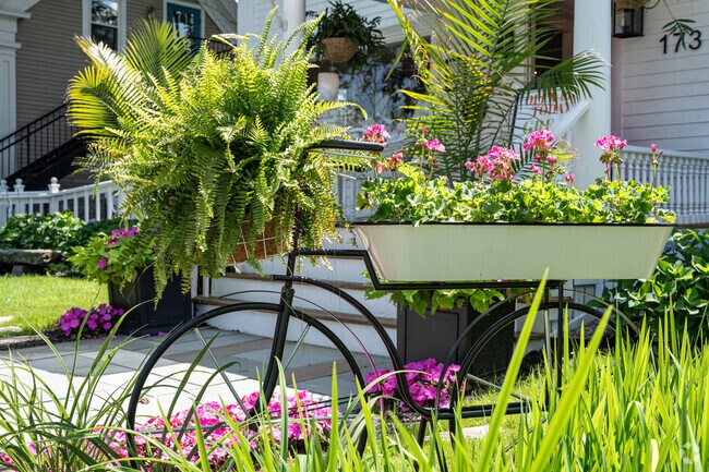 An old bicycle flower planter sits outside a Port Road gift shop in Kennebunk.