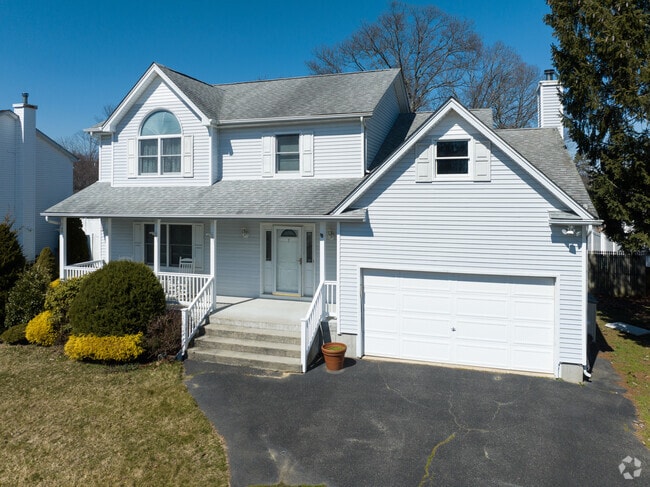 New Traditional architecture shapes this residence in the Islip Terrace neighborhood.