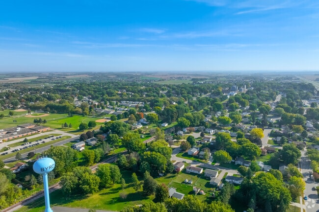 Byron neighborhood streets are lined with single-family homes and mature trees.