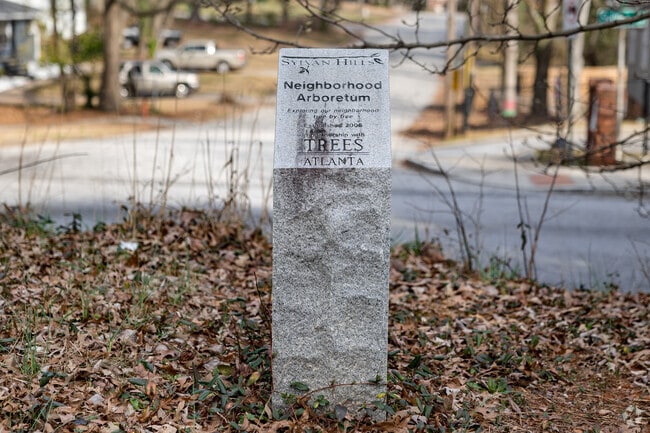 Trees Atlanta walking tour guides residents to granite markers throughout Sylvan Hills.