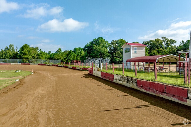 Fans cheer on their favorite drivers racing to the finish line at Rockfish Speedway in Rockfish.