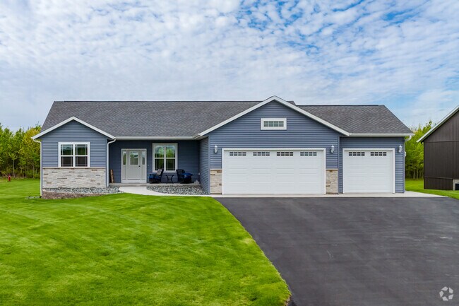 Modern ranch-style home stands out with its crips lines and well-kept lawn in Kronenwetter.