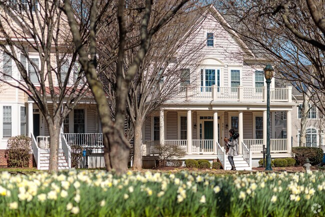 Large estate farmhouse style homes in the dense walkable neighborhood of King Farm.
