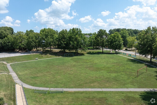 Green Pines Elementary has a sports field on the side of the building.