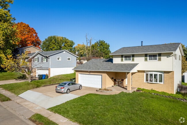 A typical split-level home with a two car garage that can be found in North Side.