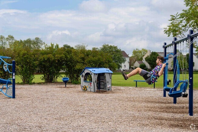 Residents enjoy the playground area at Champions Park near Augusta Village.