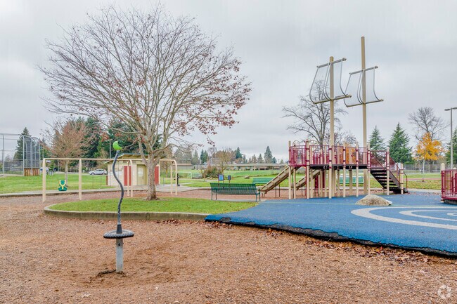 Soft material near the larger play equipment is helpful for kids at Stewart Height Park.