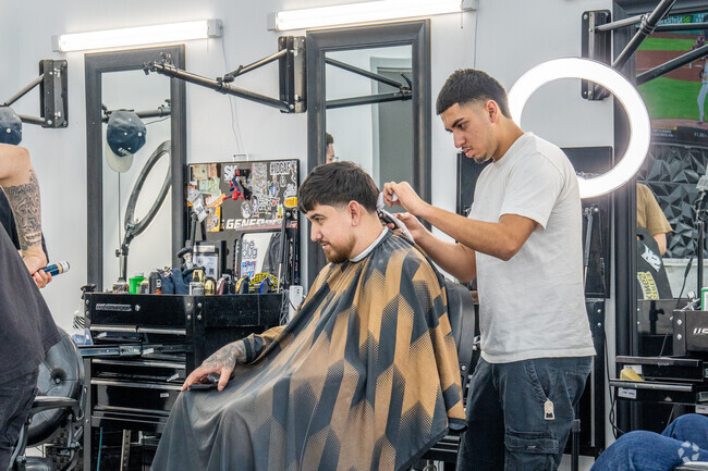 The Port Places Shoppes features many shops including a barbershop that is always busy.