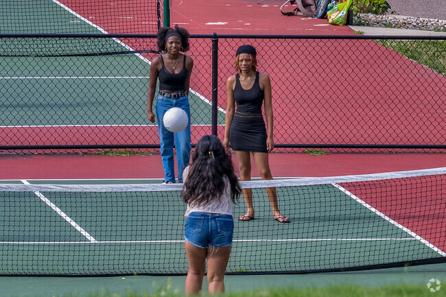 Students practice their volleyball skills at Crane Park, near Southside.