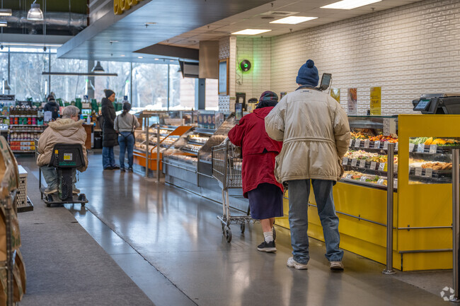 Shoppers browse the deli at the Riverdale Park Whole Foods near Calvert Hills.
