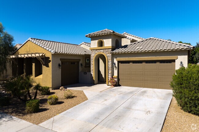 Mediterranean-style homes with desert landscaping line the streets in Emperor Estates.