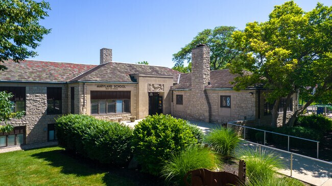 Maryland Elementary School maintains a small garden with foliage in front of the entrance.