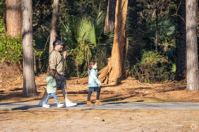 Parks in Gardner feature shaded trails under moss-draped oak trees.