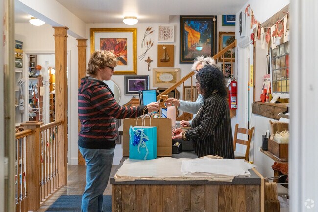A customer of Antique and Chic purchases a vintage treasure in Winfield, IL.