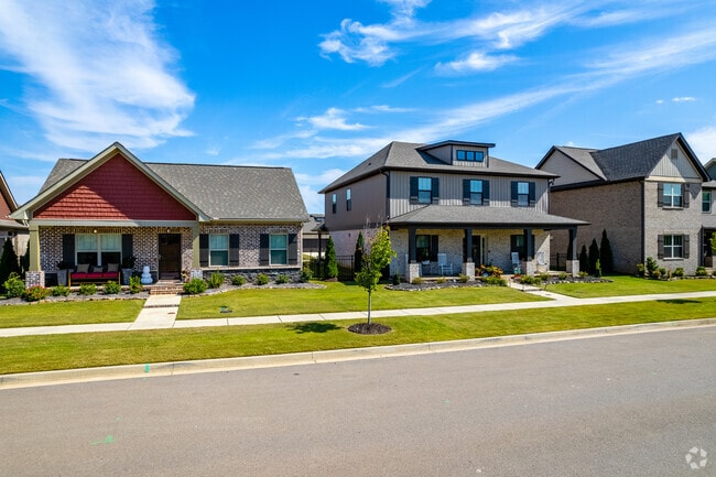 Well-manicured lawns are a frequent sight in the Athens neighborhood.