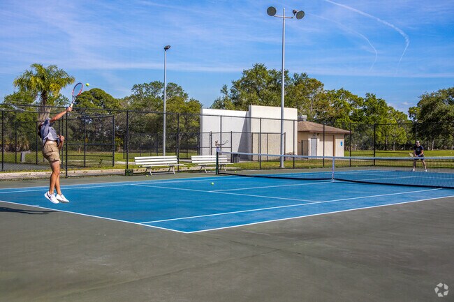 Enjoy a game of tennis with friends on the courts at Azalea park.