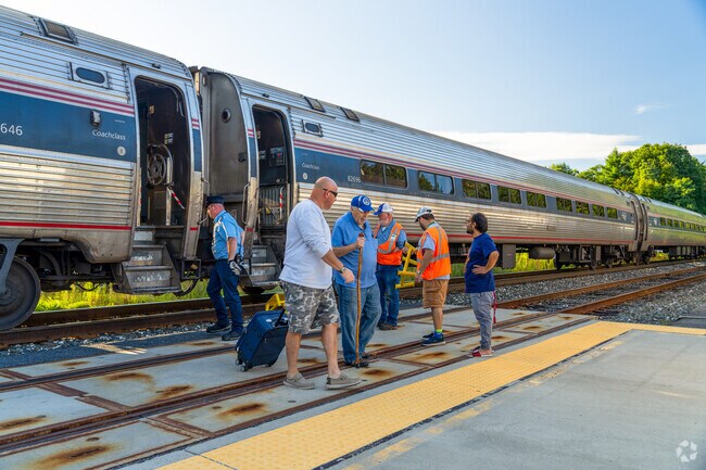 People exit the Amtrak train at Claremont Station near Maple Avenue District.