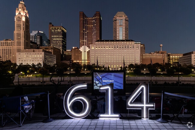 Autumn Nightlight events at Genoa Park glow against the downtown skyline.