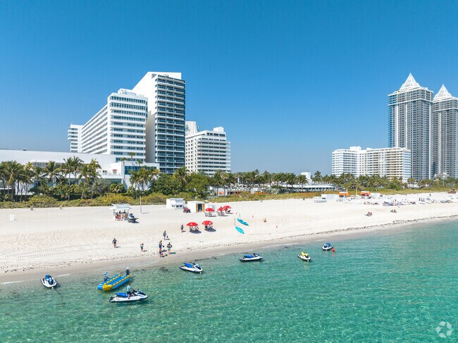 People enjoying watersports at the beach in Oceanfront.