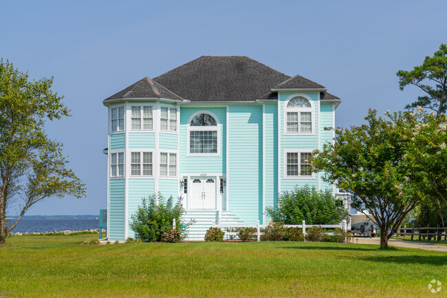 Colorful waterfront homes offer beautiful views of Croatan Sound in Manns Harbor.