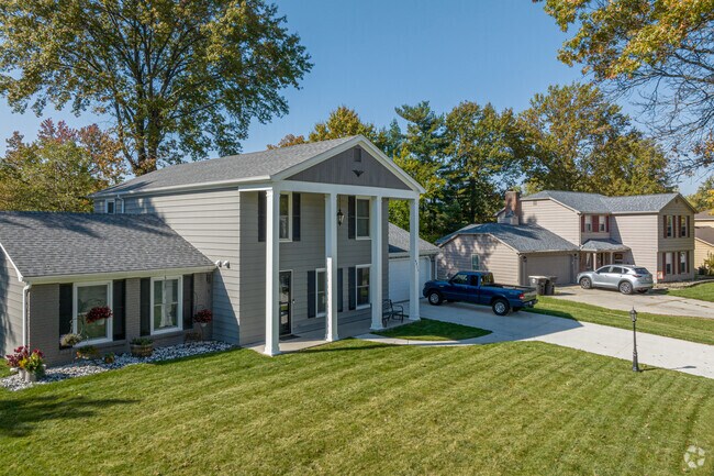 Different types of Colonial-style homes line the streets of Greentree.