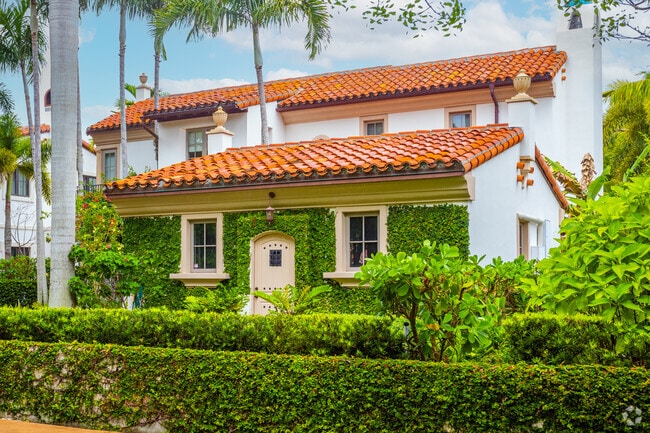 A Spanish revival-style home with a hipped roof is charming and unique in Coral Gables.