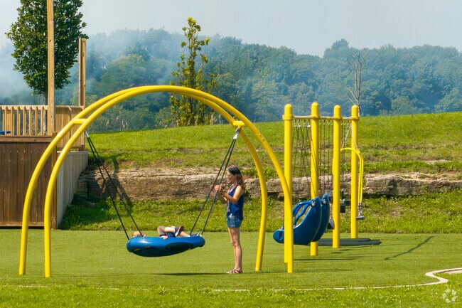 Families flock to the playground at Rotary Park.