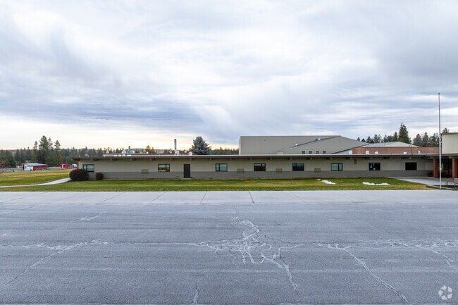 Liberty High School features a large parking lot in front of the school.