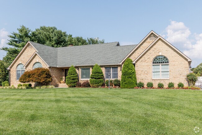Modern ranchers can be found in Highland Acres, with pitched roofs and large lots.