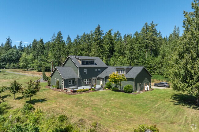 Enjoy a large lawn and plenty of privacy from your Olalla home.