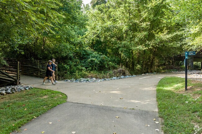 McAlpine residents enjoy a brisk walk of the McAlpine Creek Greenway.