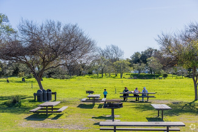 Families enjoys picnic lunch at Arrowhead Marsh in Elmhurst Park.