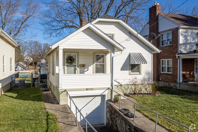 A single family home with the garage attached below in Fairfax, OH.