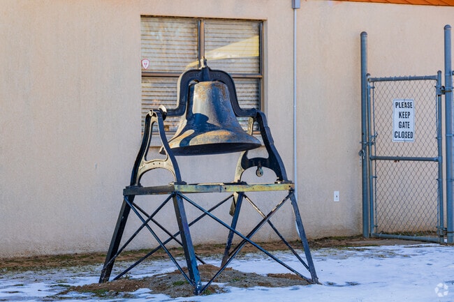 Close up shot of the bronze bell of Agra Elementary School.