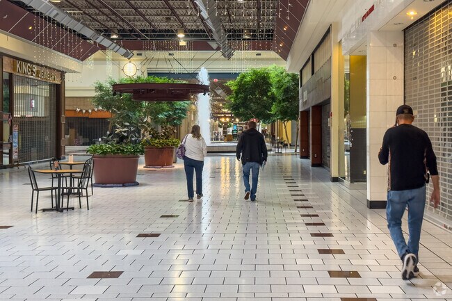 Industry residents get morning exercise walking in the Beaver Valley Mall across the river.