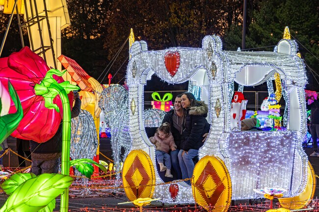 Take a family picture in the illuminated stagecoach at the LuminoCity Festival.