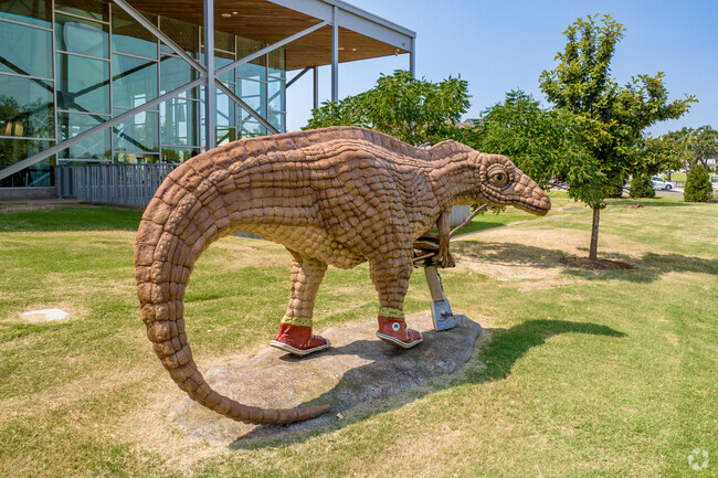 There is a fun stature of a dinosaur outside the Costco in Spring Creek.
