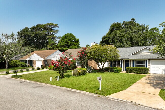 Compact traditional homes with attached garages in Whitemarsh Island.