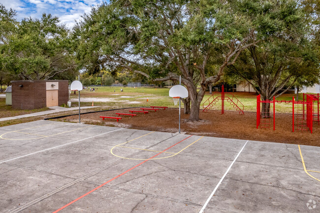 Kids can enjoy the outdoor playground & basketball courts on breaks at Walsingham Elementary.