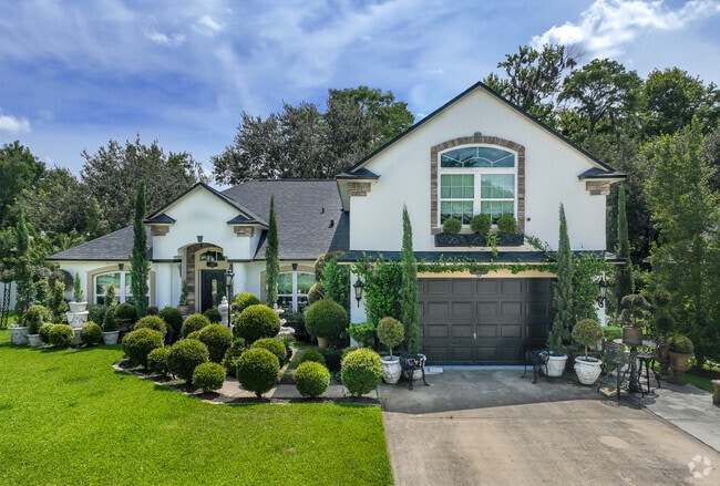 Beautiful one and two story Spanish revival style homes are located in Sunrise Oaks.