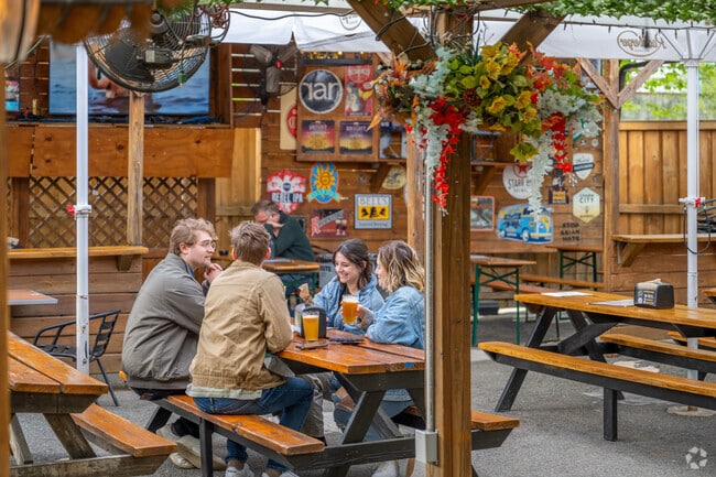 Friends can meet at Midlands Beer Garden after work for happy hour drink specials.