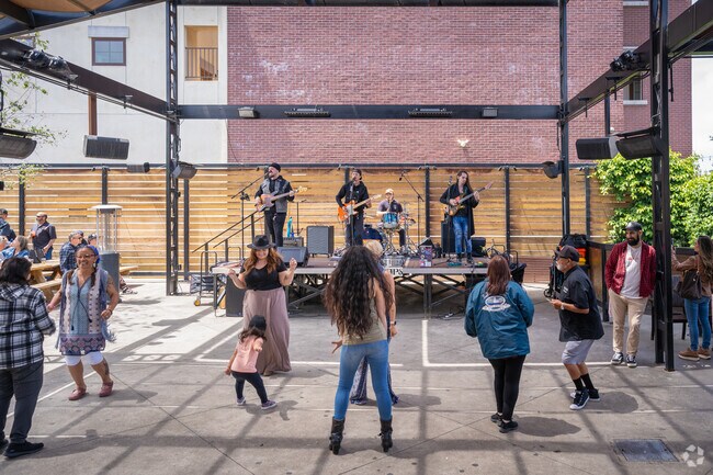 Temecula Rod Run attendees dance to the live band at Baily's near Rancho Highlands.