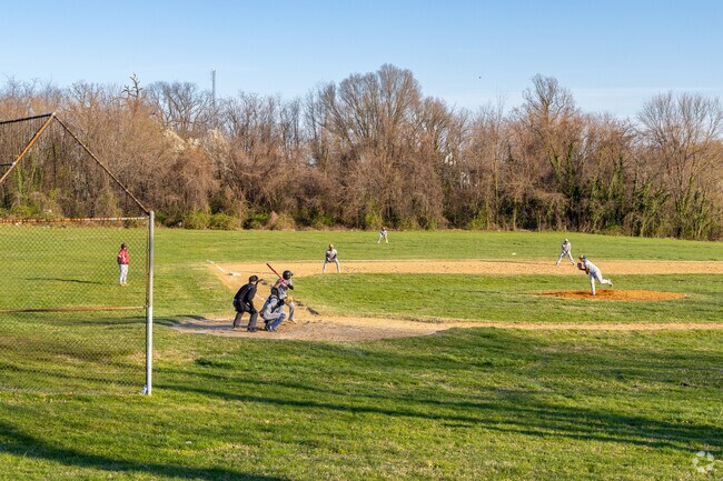 Come watch a game of baseball at the baseball field at Clifton Park in Baltimore, Maryland.
