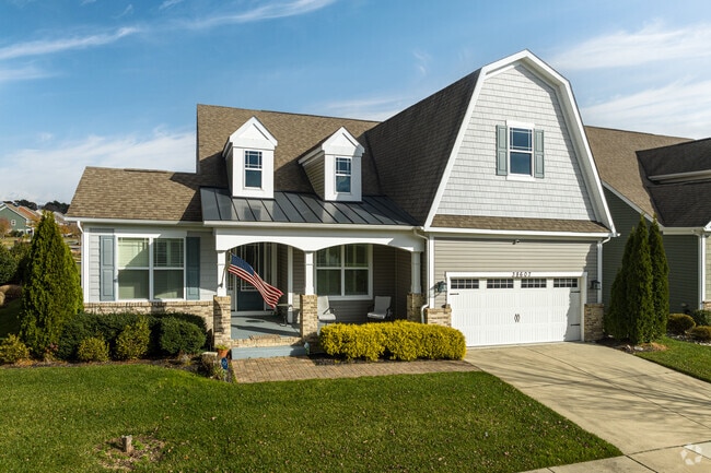 This hybrid colonial house in Millville features a Swedish-style gambrel roof.