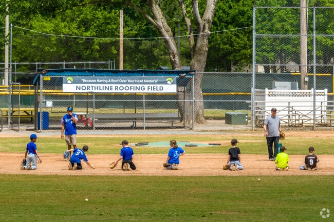 Children attend baseball practice at Arthur Goodman Park.